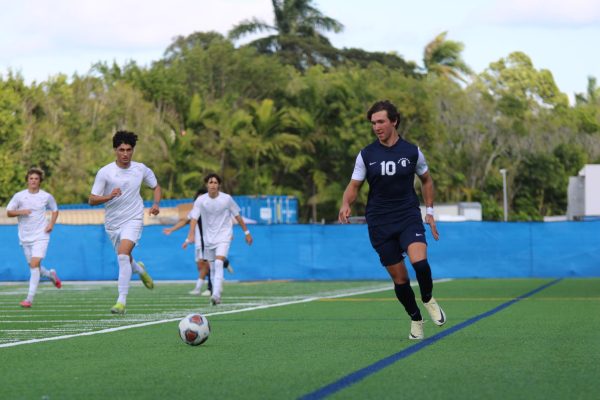 Senior and captain Tomas Sciarra kicks the ball. He assisted the team to advance to regional semifinals. He helped the team prepare for the games this season. 