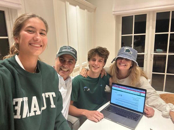 Senior Eduardo Kingston celebrates with his family after opening his acceptance letter. Kingston applied to Tulane Early Decision. He received his acceptance letter on Dec. 5, 2023.