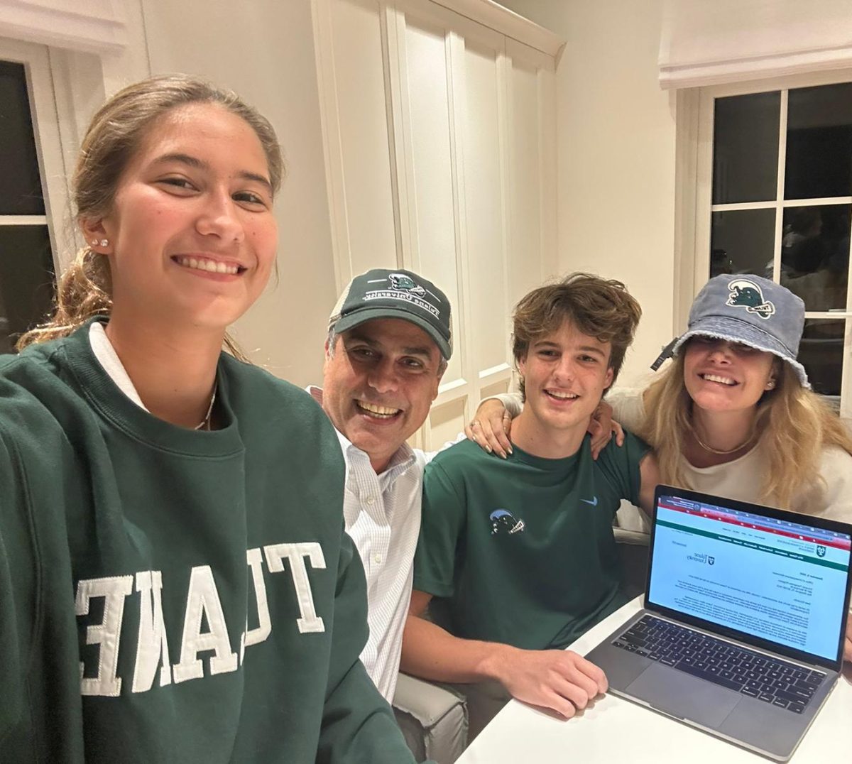 Senior Eduardo Kingston celebrates with his family after opening his acceptance letter. Kingston applied to Tulane Early Decision. He received his acceptance letter on Dec. 5, 2023.