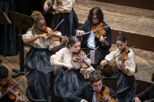 Performing in the Golden Hall of the Musikverein, during the SCL Festival the Musicall Youth Orchestra wows the audience with their passion, showcasing their skill and raising their dedication. The orchestra comprises a mixture of young talented musicians playing the violin together. 
