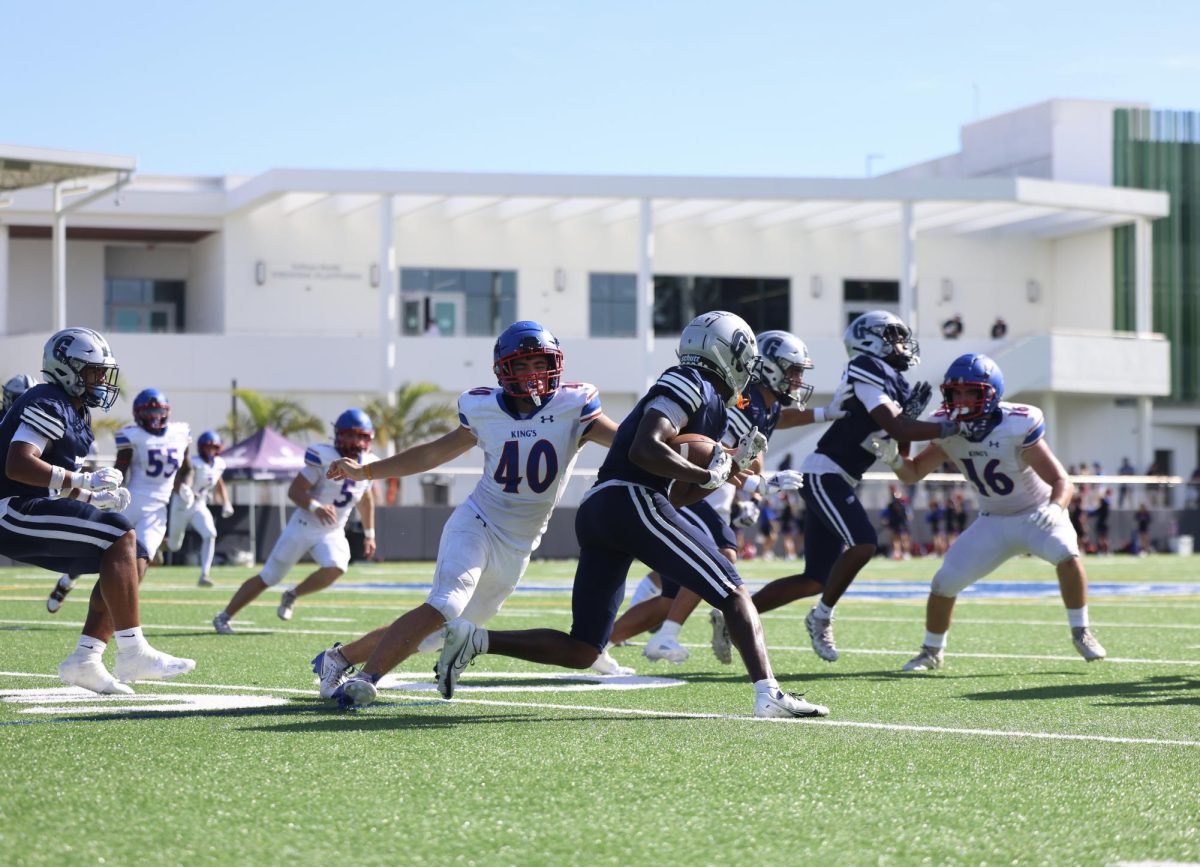 Senior defensive back/wide receiver Kenny Willams jukes out a defender off a kick return. Williams serves as the team's main kick returner, receiver and plays a big part of the Raiders’ defense.  