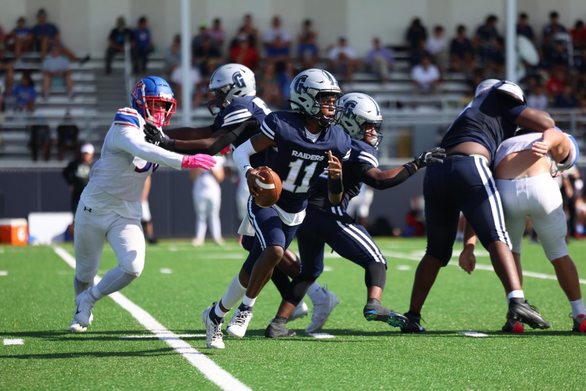 Sophomore quarterback Jonathan Walker steps up in the pocket looking down field while trying to dodge King’s academy's defensive line. Walker throughout the first half was able to lead the team on long drives putting the team in scoring position. 