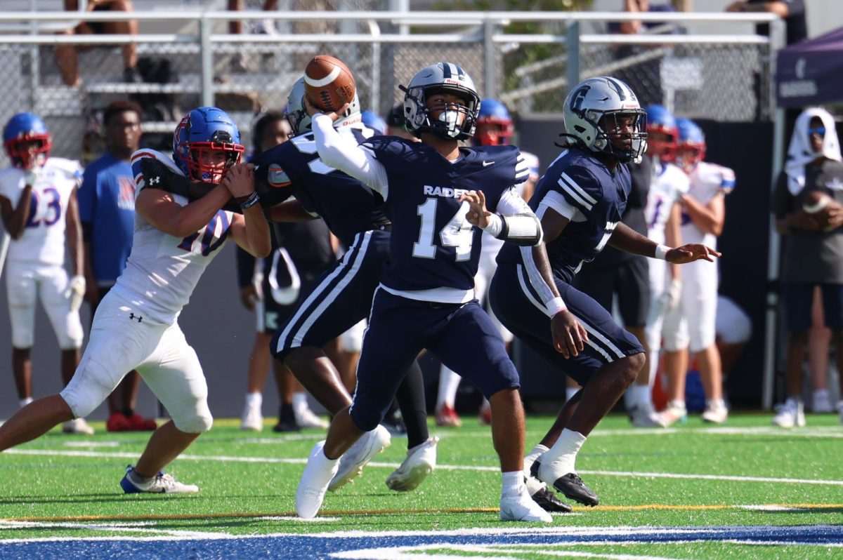 Sophomore quarterback Harvel Jackson tries to convert a third down late in the second quarter. Jackson came into the game after Sophomore quarterback Jonathan Walker left the game due to an injury. Jackson himself was dealing with an injury from the game against Monsignor Pace.
