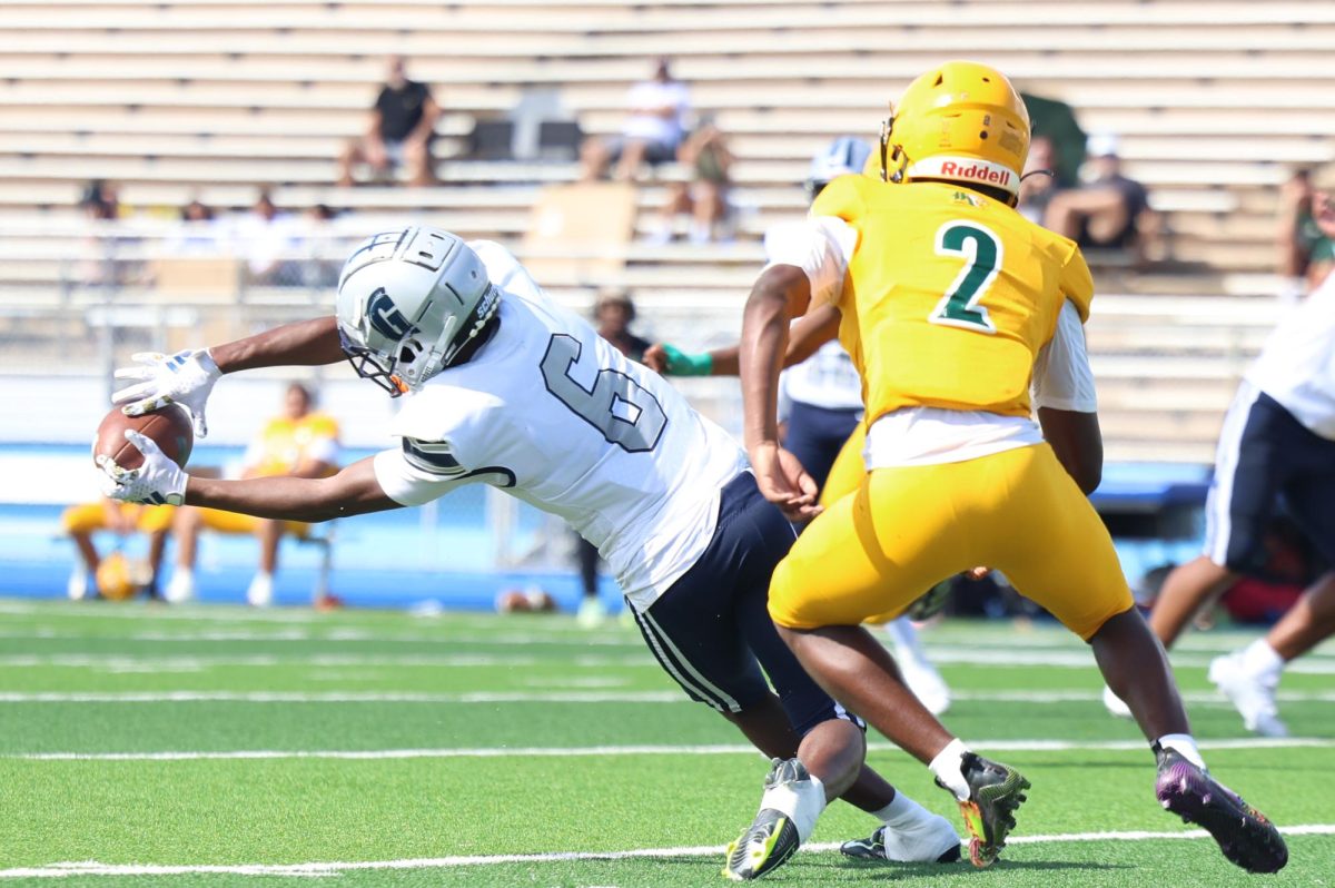 Senior wide receiver Kenny Williams stretches out to make a catch. So far this season Williams has 37 receptions,  546 yards and 7 touchdowns according to MaxPreps. 