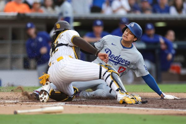 Luis Campusano (12) of the San Diego Padres applies a tag on Shohei Ohtani (17) of the Los Angeles Dodgers for an out at home plate in the third inning during a game at Petco Park on July 31, 2024, in San Diego. (Brandon Sloter/Getty Images/TNS)