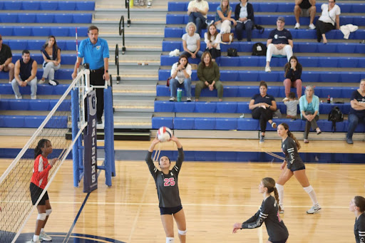 Antonella Yunez sets the ball up for a potential spike. With this setup, the Raiders spiked through a point. Yunez ended the game with 24 assists while playing in all 3 sets.