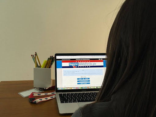 Senior Mia Bella Serralta registers to vote via mailing ballot on her computer. Although Serralta won’t be able to vote for the 2024 presidential election, she feels it’s important to be prepared. “This is an exciting responsibility so I want to be ready to vote when I turn 18.”