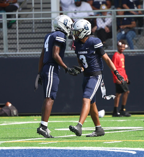 Junior defensive back Leandrez Lenoard daps up junior safety Samuel “Champ” Smith after getting a tackle. Leonard already has two interceptions this season and was coming off a game in which he posted seven solo tackles. 
