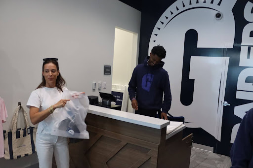 Many Gulliver parents visit the Spirit Store to show off their school pride. One Gulliver mom bought some new merchandise for the football games. Another parent picked up a sweatshirt to support the team.