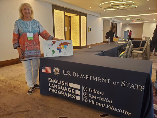 In a recent meeting in Washington D.C, IB Critical Thinking Research Design teacher, Linde Barrett, stands in front of a U.S. Department of State display. “It was an incredible opportunity to engage with leaders on a global scale and explore the role of education in international diplomacy," Barrett said.