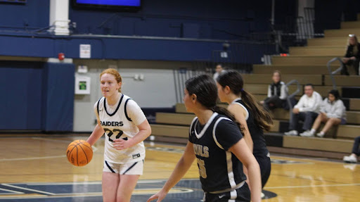 Sophomore guard Mikayla Brown bringing up the ball for the Raiders. This was the senior day game where Brown finished the game with 18 points and shot 50% from the field pulling off a win.