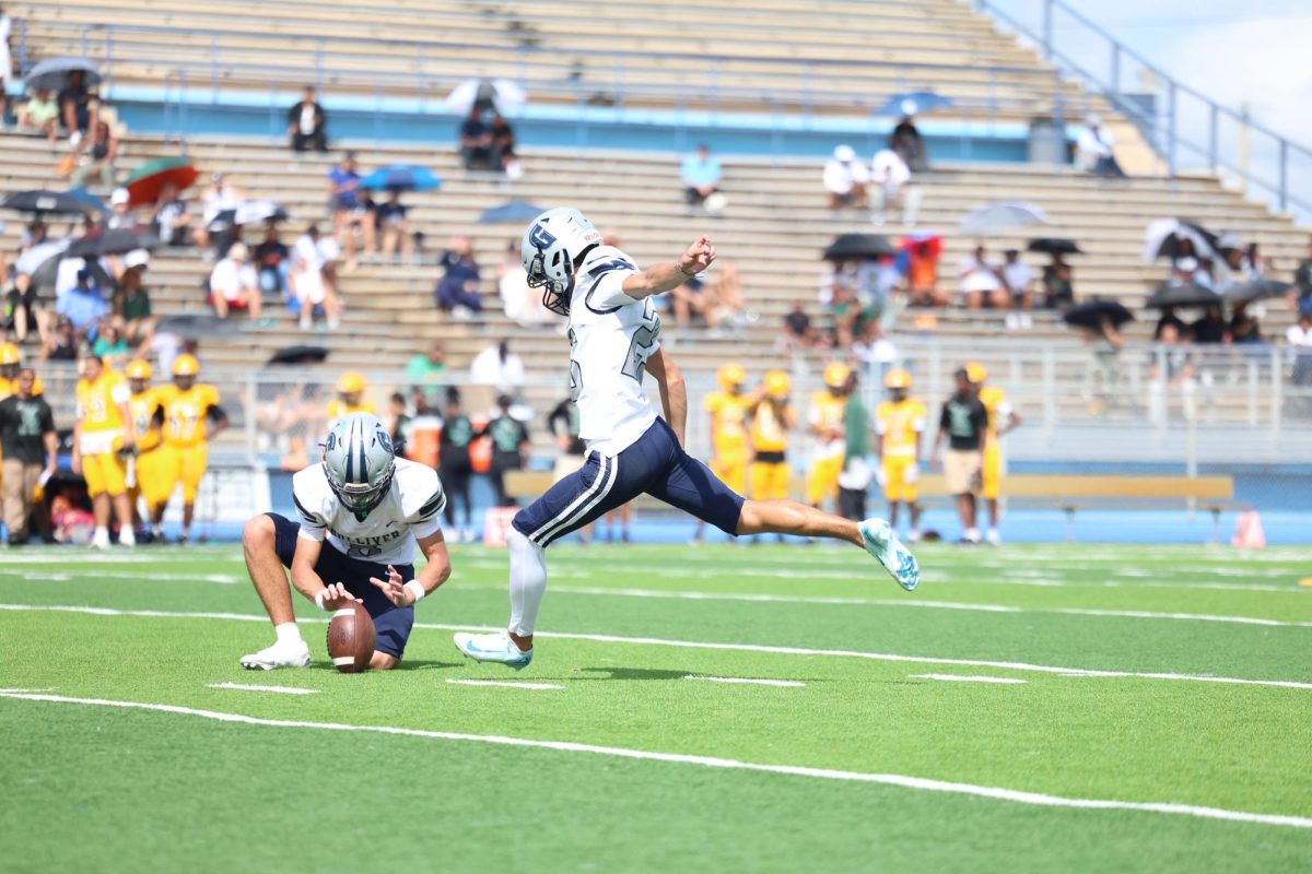 Senior kicker/punter Cris Murciano kicks an extra point to expand the team's lead. Murciano was perfect from extra point during this game.