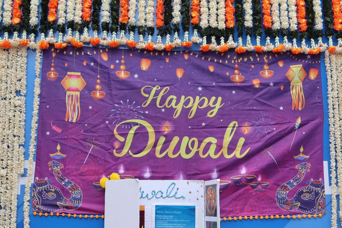 The patio decorations welcomed students and faculty alike to the Diwali celebration. The event brought people together a diverse crowd under floral decorations and colorful banners. Traditional music and food created an atmosphere of joy and unity.