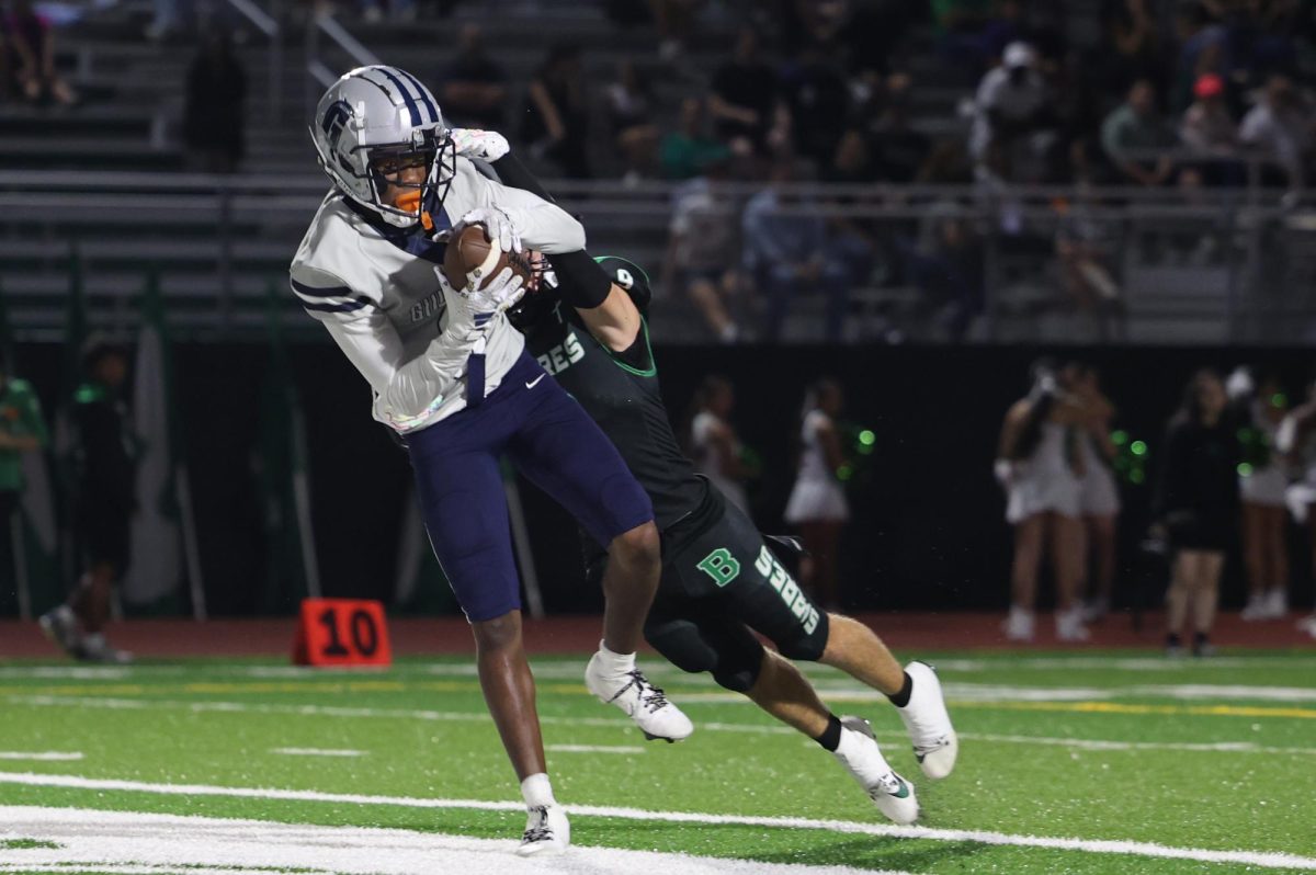 Senior wide receiver Kenny Williams catches a touchdown pass off a slant route from sophomore quarterback Jonathan Walker. Williams would end the day with two touchdowns; one receiving and one rushing.  