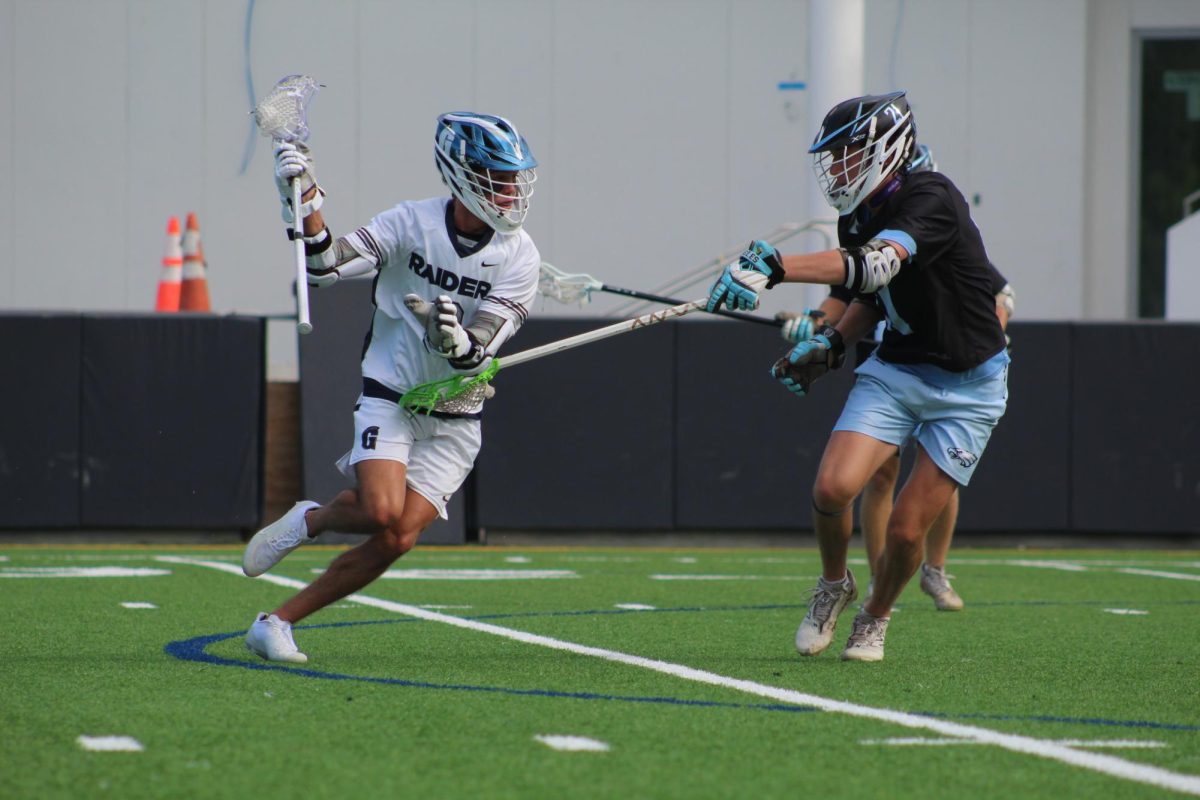 Senior Jordi Quirch Dodges past his defender while looking to score. Quirch has played a pivotal role in the lacrosse program on and off the field serving as a mentor for the younger players and being a crucial part of the team’s fast paced high power offense.   
