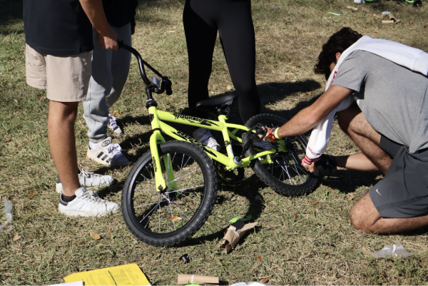 Sophomores work together to assemble bikes, demonstrating cooperation and dedication to building the foundation of Toys For Tots. The foundation's mission is to “collect new unwrapped toys and distribute them to economically disadvantaged children at Christmas [with the help of USMariness and volunteers], ” as seen on their website. 