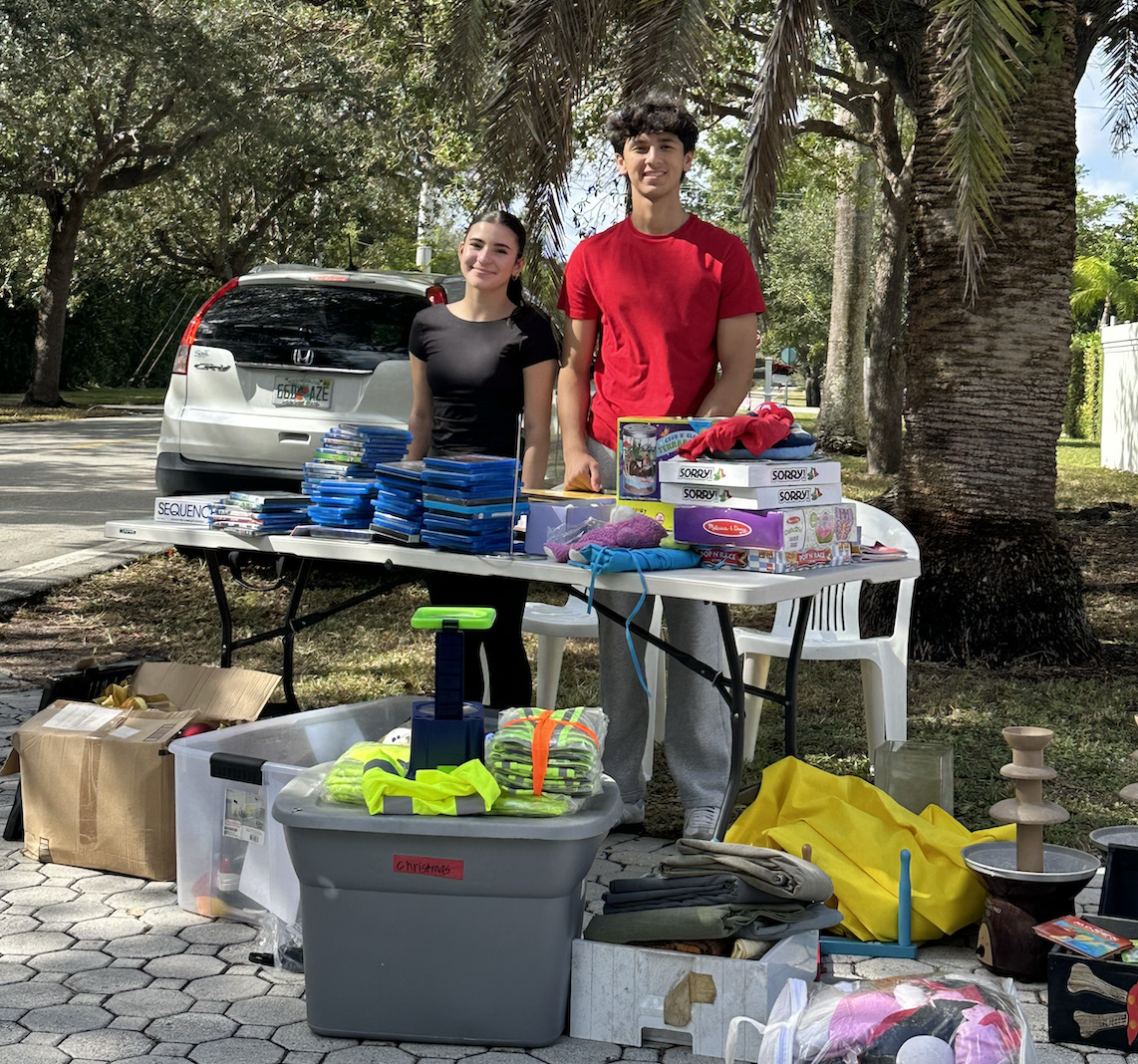 Nicolas Caraballo and Ruby Rodriguez-Valdivia at their garage sale which they used as an outlet to raise awareness, educate the public, and contribute to ongoing research efforts for Huntington’s Disease (HD). This was part of their involvement in the Health Occupations Students of America (HOSA).