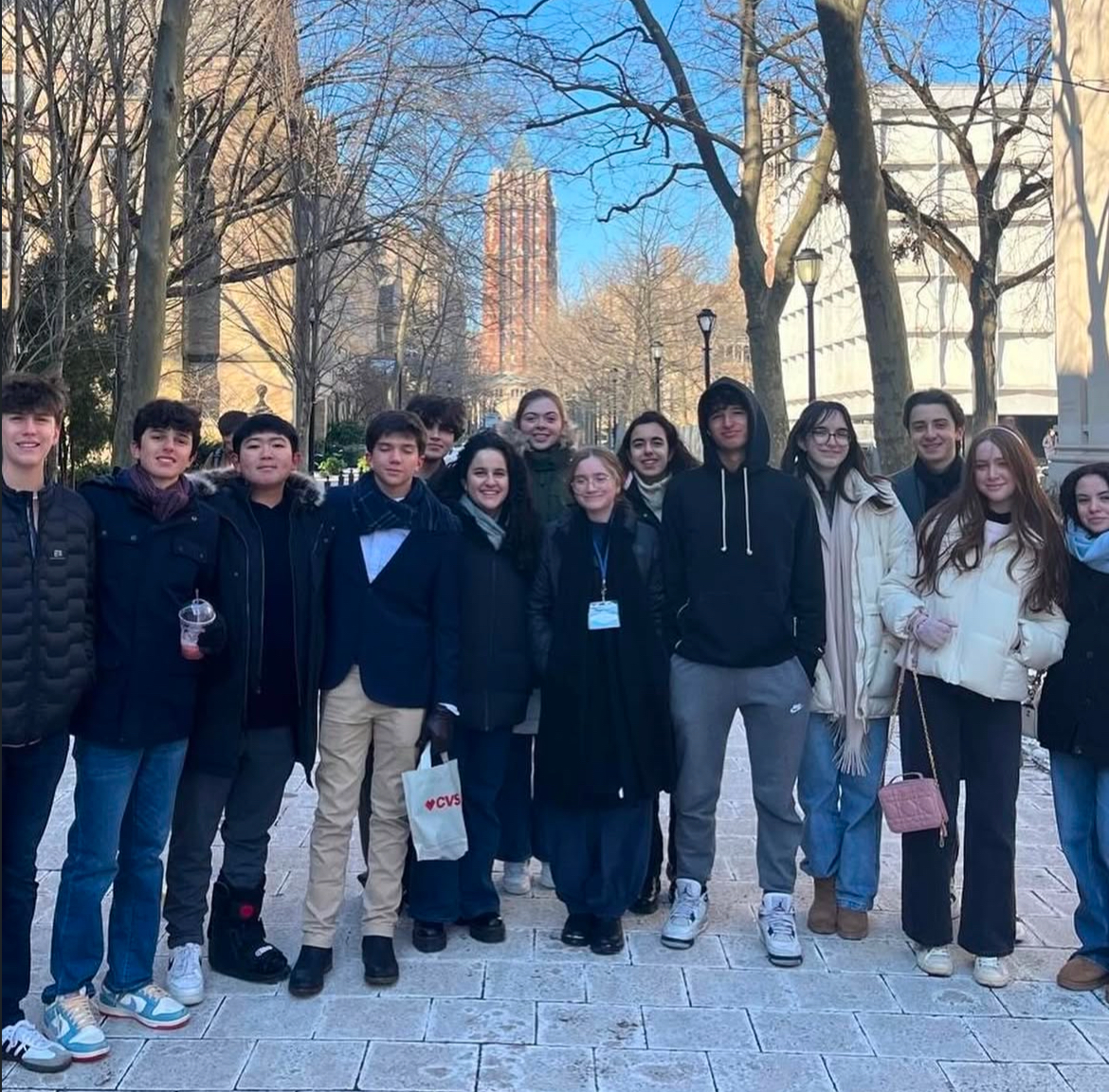 Raider YMUN competitors pose for a picture after touring Yale. "Touring an Ivy [League school] and taking group photos was a lot of fun," sophomore Valeri Bermudez said. They insulated themselves from the 29-degree Fahrenheit weather and wind chill with puffer coats, UGG boats, scarves, and gloves.