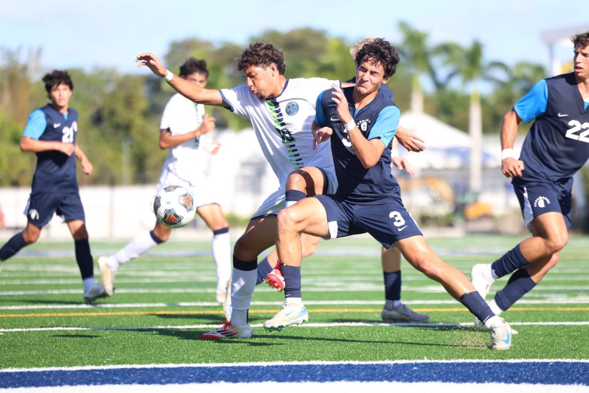 Senior defender Cristian Murciano bodies his matchup while fighting for an incoming pass.  