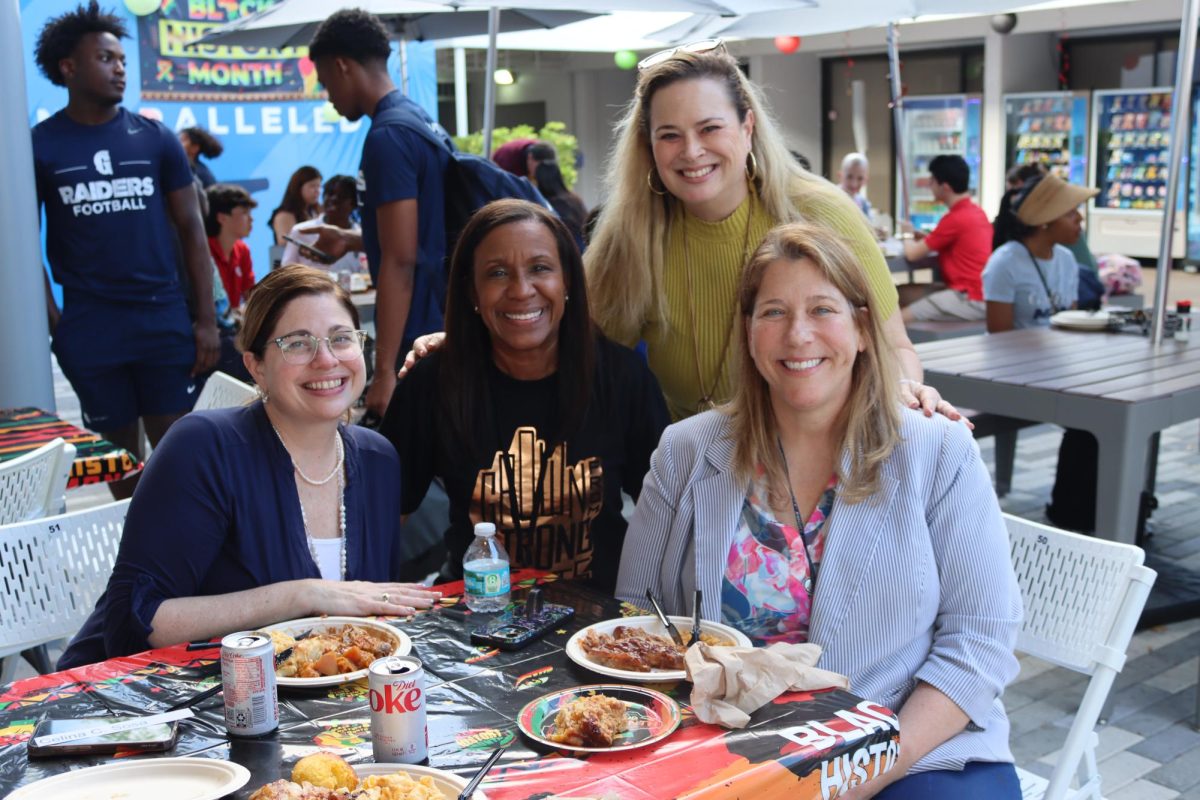 Faculty enjoy the Black History members barbecue. Activities Director Celina Sosa, Assistant Principal Donna Lee, and Biomedical Sciences teachers Yoly McCarthy and Laura Keepax gathered for a meal after school.  