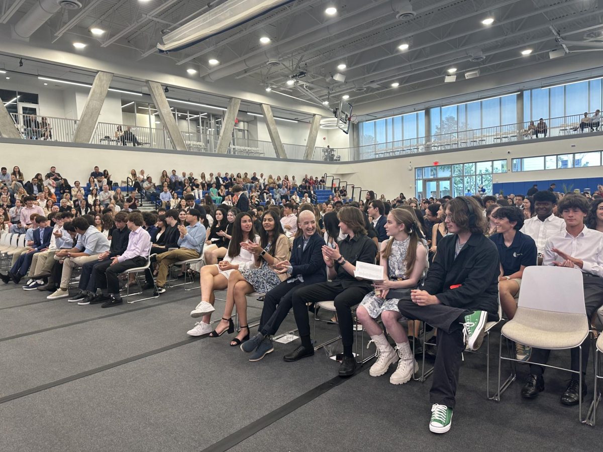 New inductees take their seats as the ceremony starts. Students from all grades were inducted to their respective  honor societies. This was the school's first ever combined induction ceremony for all the honor societies. 