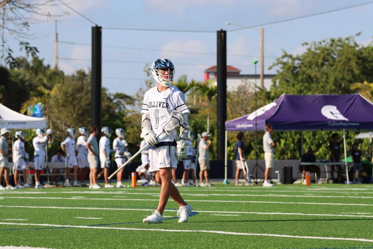 Senior Sebastian Schnur gets in position before the play. In his fourth season on Varsity, Schnur is the team captain and has been a vital part of the team's success.