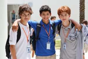 Freshmen Andres Salazar, Thomas Barker, and Cristobal Gonzalez wear their polos and IDs, as required by the school dress code. The new policy restricts cub t-shirts and spirit gear to Fridays. 