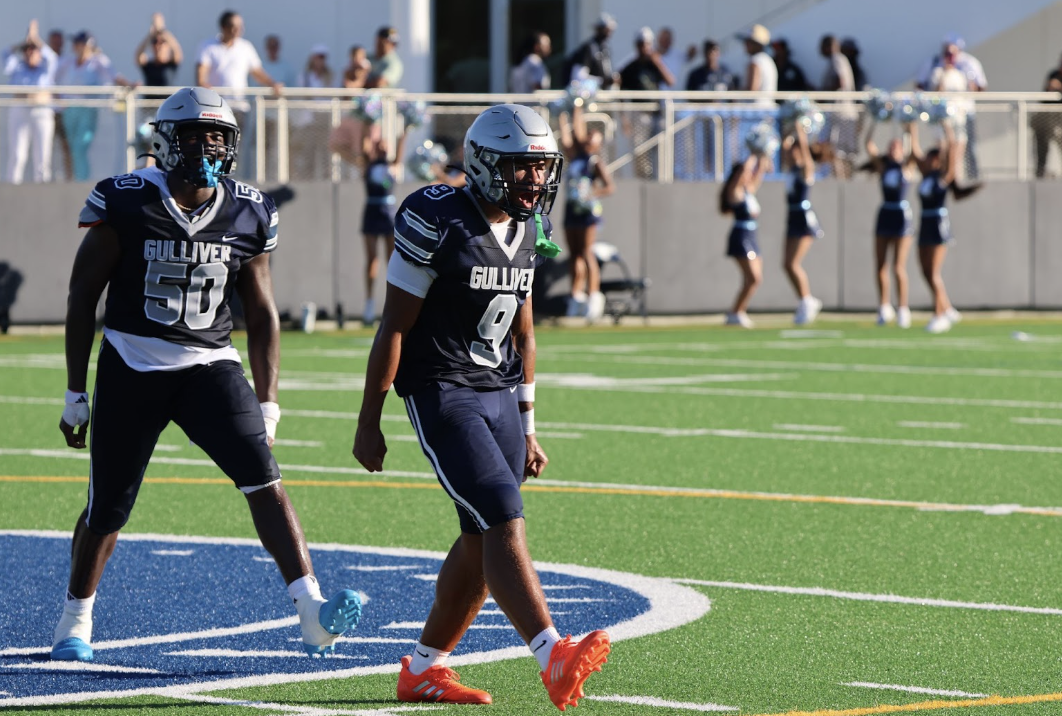 Senior Wide Receiver Luc Carrol and freshman Offensive Lineman Gabe Ellis celebrate after the game ends. Carroll scored a 58-yard touchdown to complete an epic comeback for the Raiders.