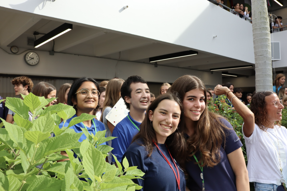 Race to Breakthrough captains Salome Tarac and Micaela Pal smile with friends during Breakthrough Spirit Week in the Atrium. Both students help lead efforts to encourage registration for the annual fundraiser supporting Breakthrough Miami. Their leadership played a key role in organizing the student-faculty dance-off that energized the school community this morning.