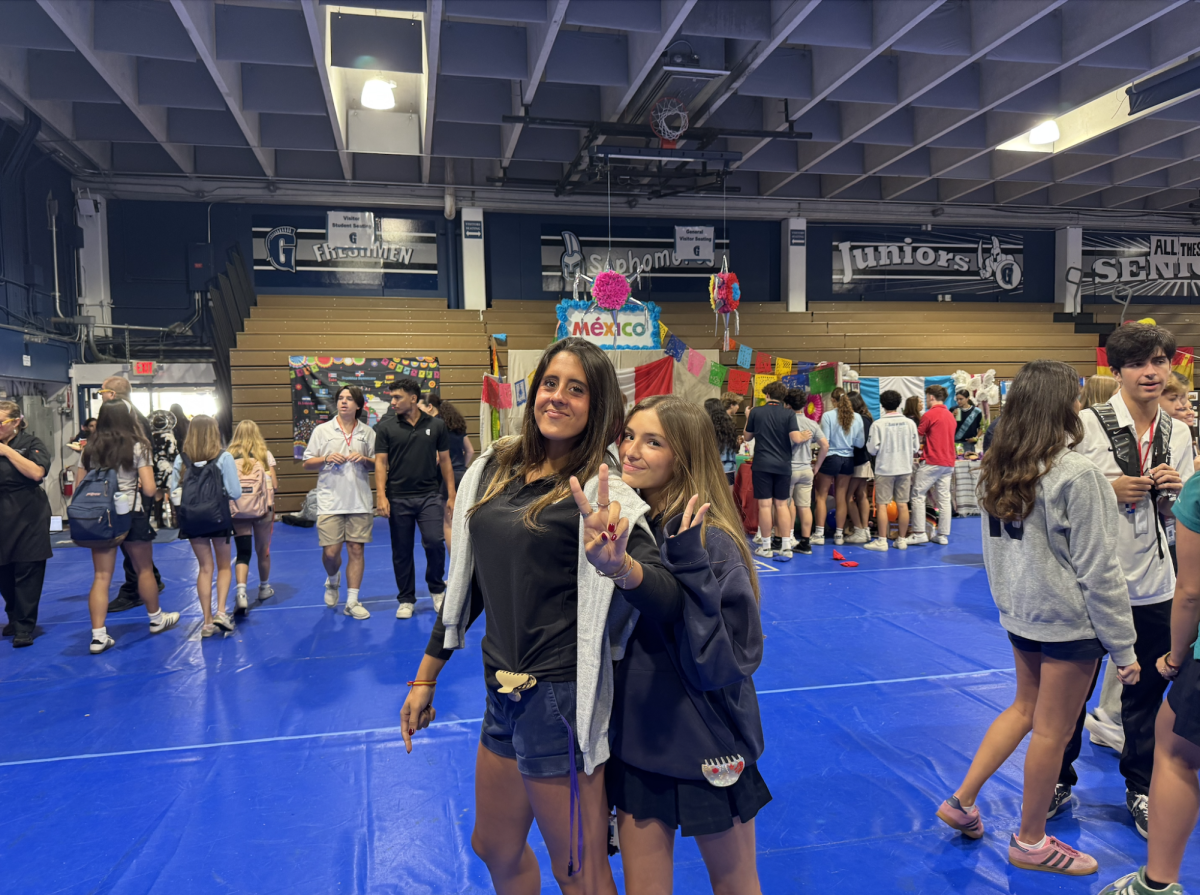 Ariana Sagrera '28 Isabela Gouvea '28 enjoying the Hispanic Heritage Month Celebration. Behind them, the Mexico booth with piñatas and festive colors. Visitors experienced Mexican culture through food, decorations, and activities that brought the country’s traditions to life.
