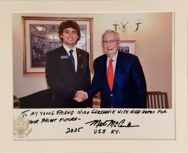 Nicolas Gershanik shakes hands with Senator Mitch McConnell after being nominated and selected to serve as a U.S. Senate Page. The experience has given him new insights into leadership and government service.