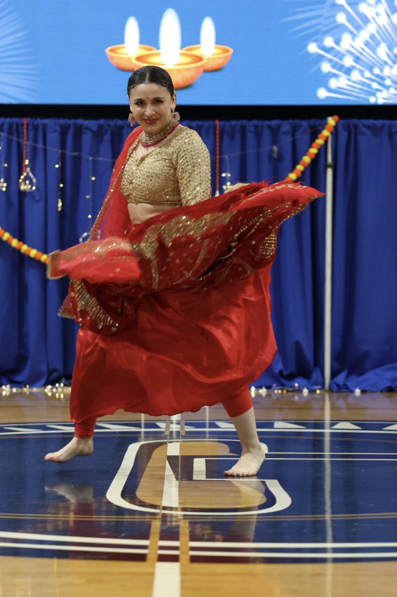 Professional dancer performing a traditional South Asian dance in the Blue Dungeon. The assembly was held on Wednesday, October 8, to honor the South Asian cultural celebration of Diwali. 