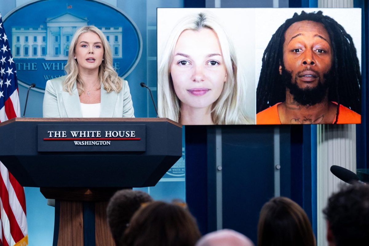 White House press secretary Karoline Leavitt speaks alongside a photo of Ukrainian refugee Iryna Zarutska, who was allegedly killed by Decarlos Brown Jr., right, on a light rail train in Charlotte, North Carolina, during a news briefing in the Brady Press Briefing Room of the White House in Washington, D.C., Sept. 9, 2025. (Saul Loeb/AFP/Getty Images/TNS)