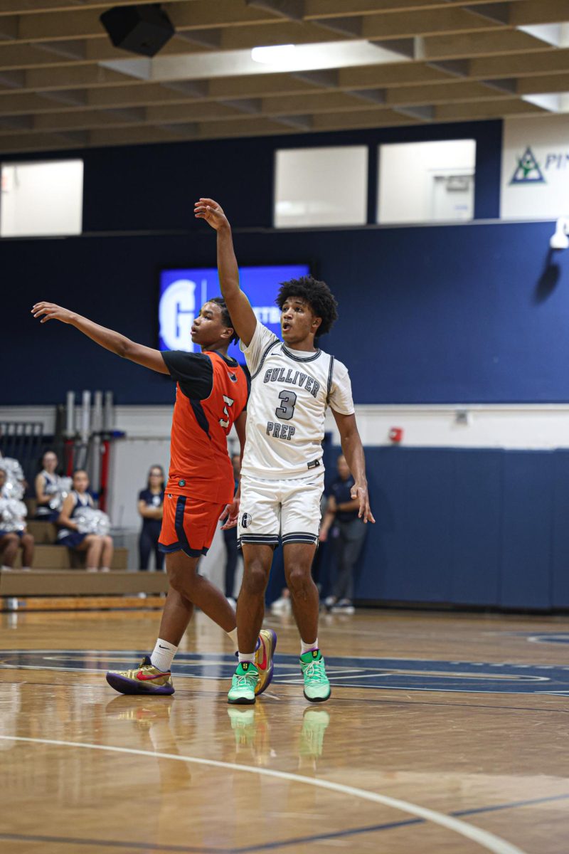 Senior guard Champ Smith hits a three. Smith faced a double team from the defense the whole game forcing him to rely on his teammates.