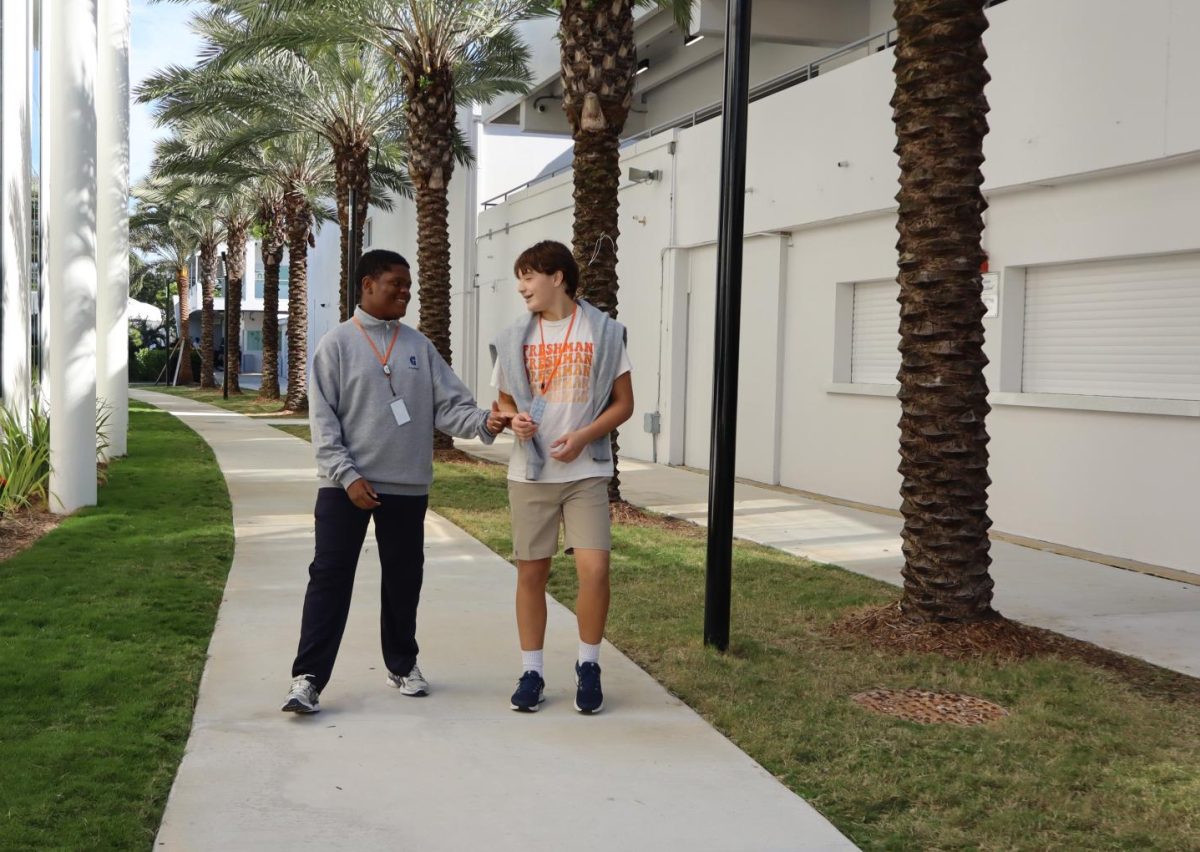 Freshmen Seth Kelly and Harrison Phillips follow the dress code policy on colder days. Despite the temperature being cooler, the boys were able to stay warm with school approved uniform choices.