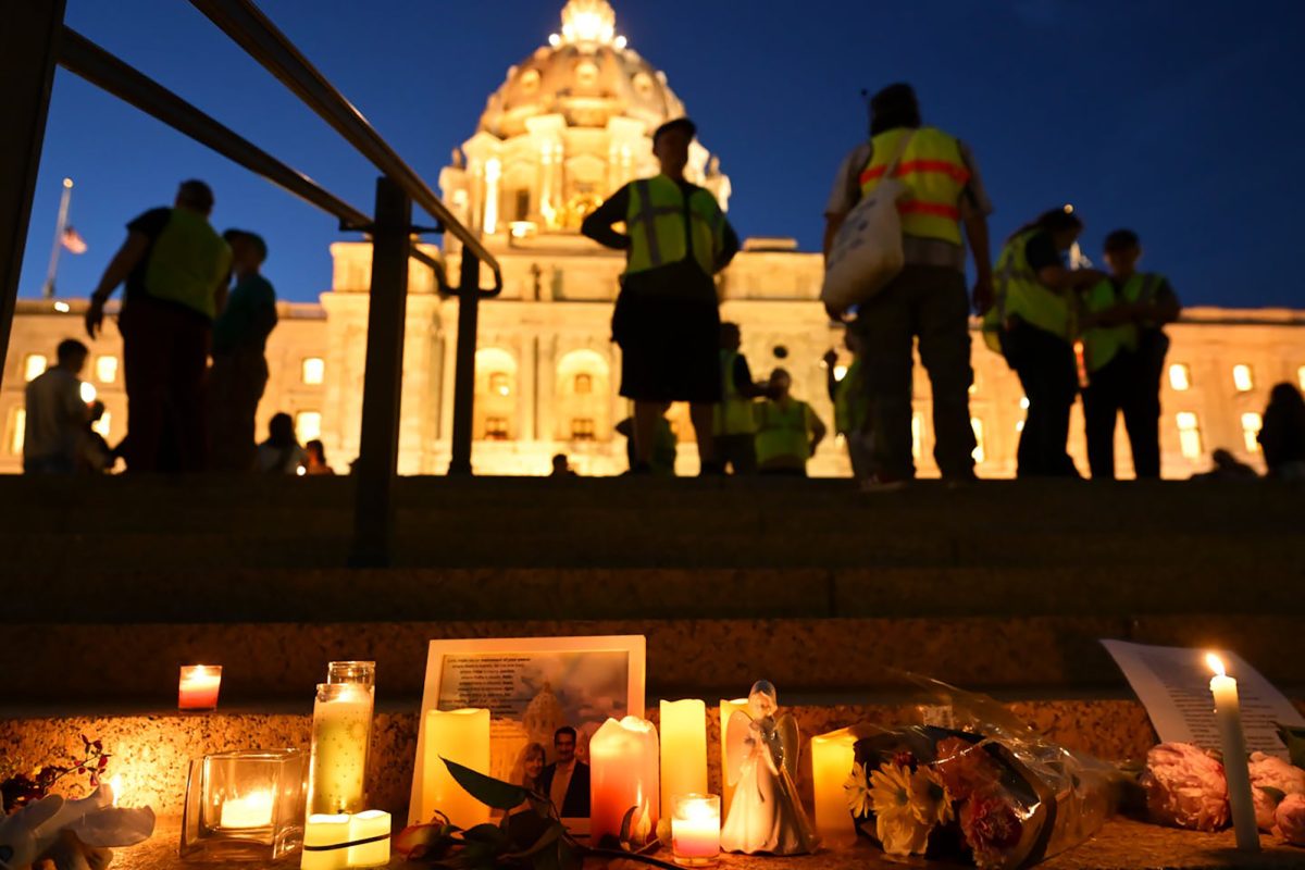 Candles, photos and flowers are left during a candlelight vigil on June 18, 2025, at the State Capitol in St. Paul, Minnesota, for Melissa and Mark Hortman, who were killed in what officials have called a targeted act of political violence. (Aaron Lavinsky/The Minnesota Star Tribune/TNS)