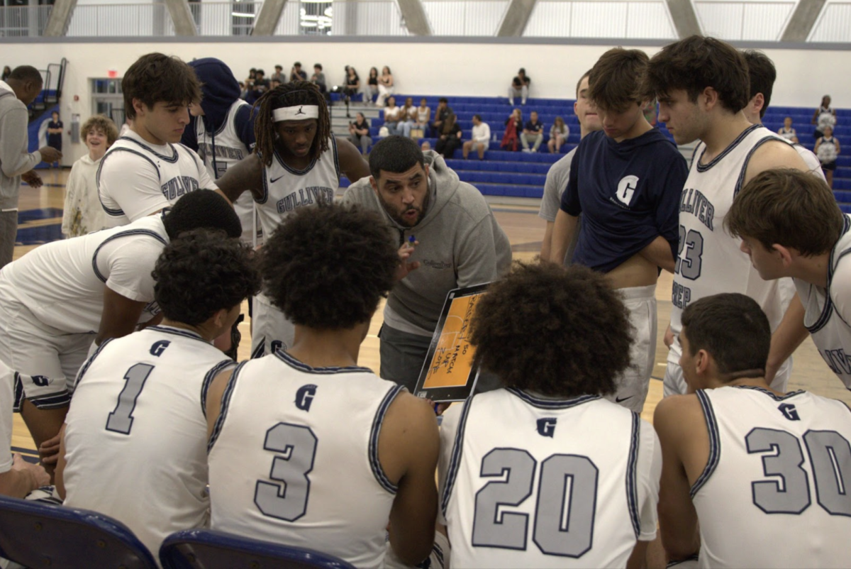 Head Coach Hossam Marquez draws up a play before the game. This is Maruqez’s second season as a head coach, but he has been with the program for 17 years. 