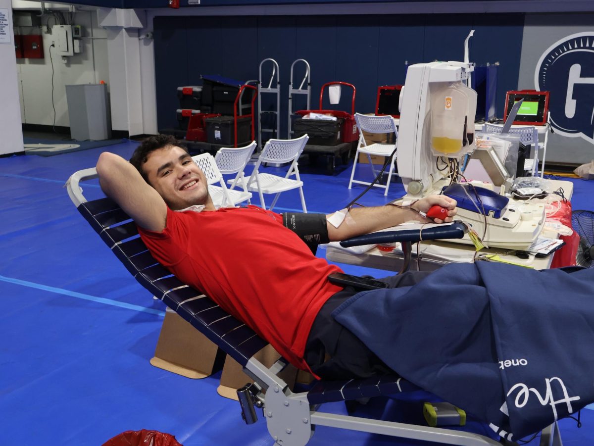 Senior Hugo Komaransky gets his blood drawn at the Annual Fall Bood Drive in the Blue Dungeon. The blood drive was organized by Biomedical Sciences Department Chair Mrs. Keepax. Students over the age of 16 flooded to the event to donate blood and save lives. 