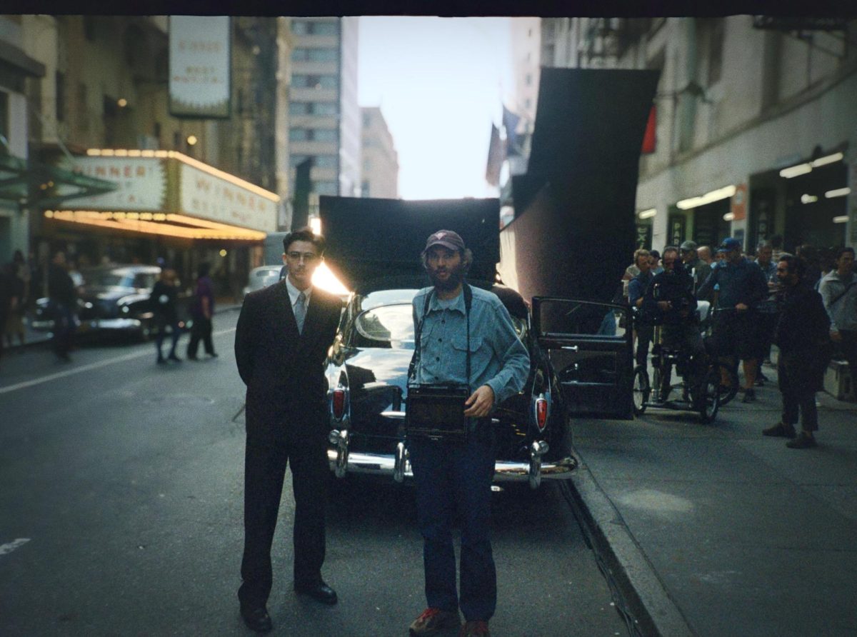 Timothée Chalamet, left, and Josh Safdie on the set of "Marty Supreme." (Atsushi Nishijima/A24/TNS)