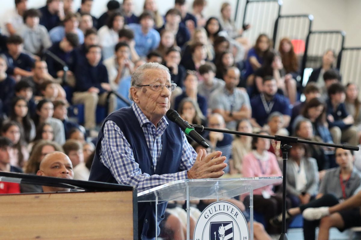 Holocaust survivor Peter Fuchs speaks to the Upper School community in the Hu Court. Fuchs reflected on his childhood during the Holocaust and his career as a composer and conductor during the assembly held on Jan. 22.