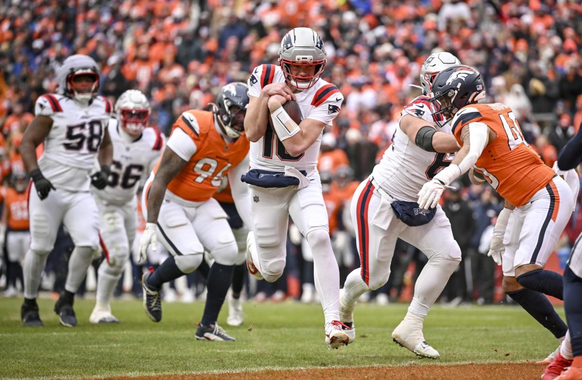 Drake Maye (10) of the New England Patriots rushes in for a touchdown against the Denver Broncos during the second quarter at Empower Field at Mile High in Denver on Sunday, Jan. 25, 2026. (AAron Ontiveroz/The Denver Post/TNS)