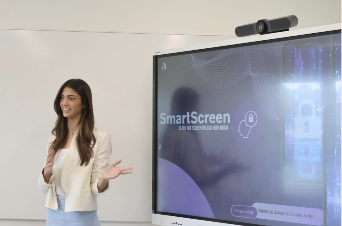 Sophomore Camila Ardid presents her team’s opening slide. Students have worked on these pitches since September, with their final pitch being a culmination of five deliverables. 