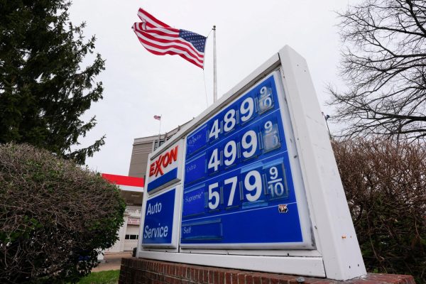 A board displays gas prices amid the ongoing conflict with US-Israeli conflict with Iran,  in Washington D.C., U.S., March 15, 2026. REUTERS/Aaron Schwartz